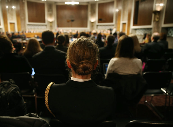 A Senate Armed Services Committee hearing in February on the subject of women in the military. On Tuesday, the Senate approved a military policy bill that would require women to join men in registering for the draft. 