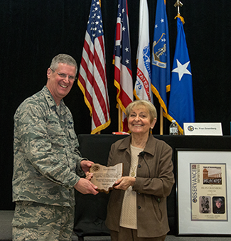 Maj. Gen. Mark E. Bartman (left), Ohio adjutant general, presents a plaque of appreciation to Fran Greenberg.