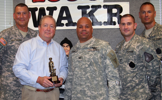 Col. John C. Harris Jr. (third from left), Ohio assistant adjutant general for Army, presents a Minuteman Award to Rubber City Radio (WAKR/WONE/WQMX/AkronNewsNow.com, Akron) President Thom Mandel (second from left) for the media group's participation in the Noncommercial Sustaining Announcement program.