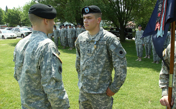 Sgt. Mark Phillips of Company C, 1st Battalion, 148th Infantry Regiment, receives an Army Achievement Medal June 11, 2011