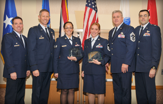 Senior Airman Madeline Carpenter (third from left) and Master Sgt. Jaime Chinn (fourth from left), both members of the 178th Fighter Wing, Springfield, Ohio, pose for a photo with their wing leadership Dec. 1, 2012, during the Ohio Airman of the Year awards banquet in Dublin, Ohio. 