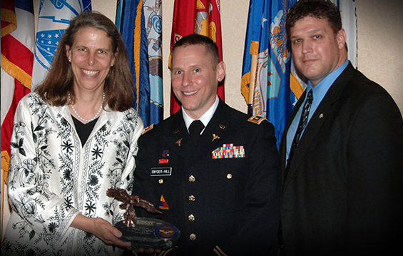 On behalf of the City of Columbus, Ohio, Dr. Theresa Long (left), city health commissioner, receives the Employer Support of the Guard and Reserve Pro Patria Award, the highest state-level ESGR honor