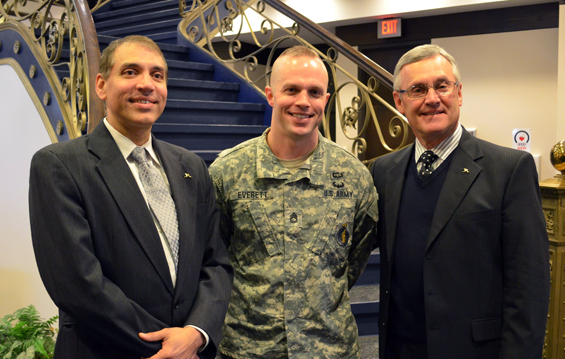 Dr. Ravi Krovi (left), dean of the University of Akron’s College of Business Administration, and Jim Tressel (right), vice president of strategic engagement at UA, thank Sgt. 1st Class Todd Everett, an Ohio Army National Guard recruiter stationed at the university, for helping facilitate a two-day leadership challenge exercise for students at the business school.