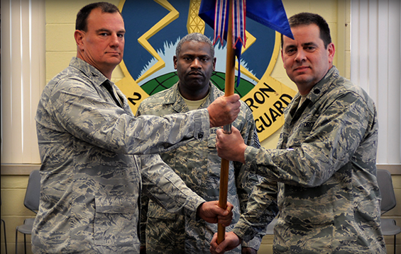 Col. Norman Poklar (left), commander of the 251st Cyberspace Engineering Installation Group, transfers command of the 220th Engineering Installation Squadron to Lt. Col. Kevin Cukrowicz (right).