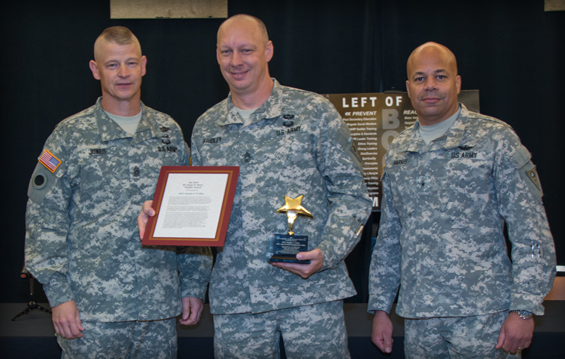 Master Sgt. Joseph Fridley (center), Ohio Army National Guard Military Personnel Office personnel branch manager, receives the 2014 Brig. Gen. Roger E. Rowe Quality Award from Command Sgt. Maj. Rodger M. Jones (left), state command sergeant major, and Brig. Gen. John C. Harris Jr., assistant adjutant general for Army.
