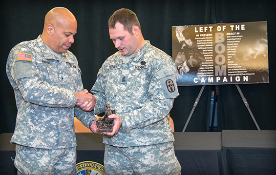 Brig. Gen. John C. Harris Jr. (left), Ohio assistant adjutant general for Army, congratulates 1st Sgt. Ty Henery of the 285th Medical Company on winning the 2013 Capt. John R. Teal Leadership Award 