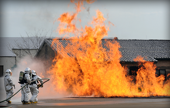 Airmen with the 121st Civil Engineering Squadron Fire Department fight a blaze during a live-fire training exercise.