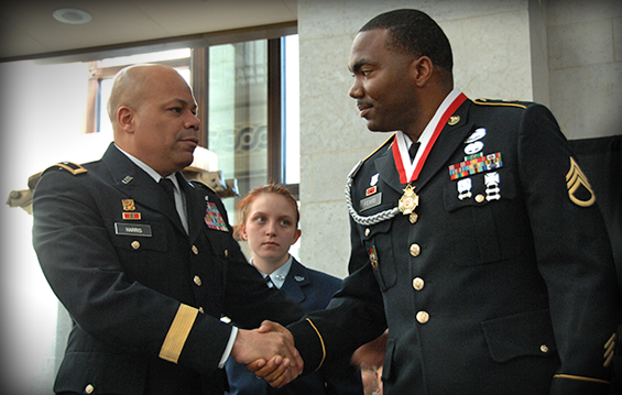 Maj. Gen. John C. Harris Jr. (left), Ohio assistant adjutant general for Army, congratulates Staff Sgt. Robert B. Fears after his induction into the Ohio Military Hall of Fame.