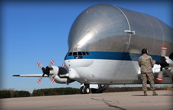 Members of the 179th Airlift Wing assist during the arrival of the Super Guppy, a massive aircraft designed to transport oversized cargo.