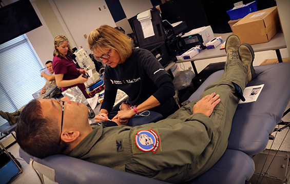 Col. Andrew Lee, a physician with the 179th Medical Group, donates blood.