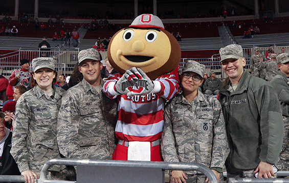 Brutus Buckeye, The Ohio State University mascot, poses for a picture Nov. 7, 2015, with members of the Ohio Air National Guard.