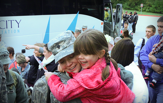 Soldiers of the 1st Battalion, 174th Air Defense Artillery Brigade, are welcomed home by their families and friends.