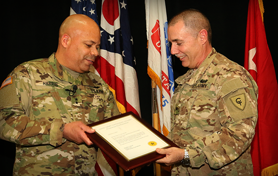 Maj. Gen. John C. Harris Jr. (left), Ohio assistant adjutant general for Army, presents a plaque to newly promoted Brig. Gen. Gordon L. Ellis.