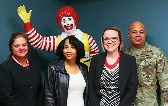 Priscilla Kidd (second from left), widow of Chief Kidd, and Ohio's assistant adjutant general for Army, Maj. Gen. John C. Harris, Jr, (right), pose with Ronald McDonald House staff.