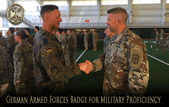 Lt. Col. Daniel Long (right), deputy commander for the 174th Air Defense Artillery Brigade, shakes hands with Sgt. Maj. Walter Ising, a liaison officer with the German army.