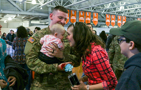 A Soldier assigned to the 1st Battalion, 148th Infantry Regiment spends time with his Family.