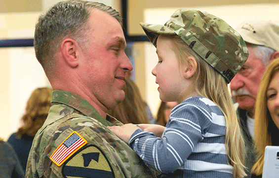 Family members greet their Soldiers after a welcome home ceremony for the 204th Engineer Detachment.
