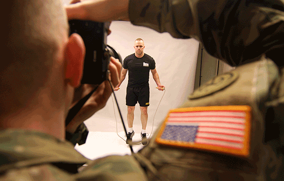 Master Sgt. Todd Everett, noncommissioned officer in charge of Echo Company, Ohio Army National Guard Recruiting and Retention Battalion, demonstrates Warrior Fit exercises during a photoshoot.