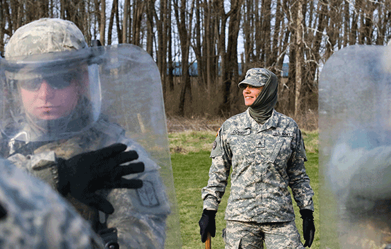 Sgt. Sarah Covert (center) observes Soldiers during a class on crowd control operations