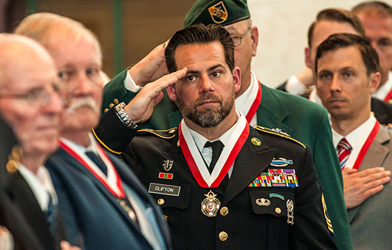 Retired Master Sgt. Sean Clifton, formerly of Company B, 2nd Battalion, 19th Special Forces Group, salutes as a color guard retires the colors at the conclusion of the induction ceremony for the 2017 class of the Ohio Military Hall of Fame for Valor May 5, 2017, at the Ohio Statehouse in Columbus Clifton was awarded the Bronze Star for valor during a 2009 deployment to Afghanistan.<a href= /stories/2017/May/20170505-MilitaryHoF.html><strong> READ MORE</strong></a>