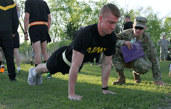 Spc. Tyson Montgomery, of Headquarters and Headquarters Battery, 1st Battalion, 134th Field Artillery Regiment, does pushups.