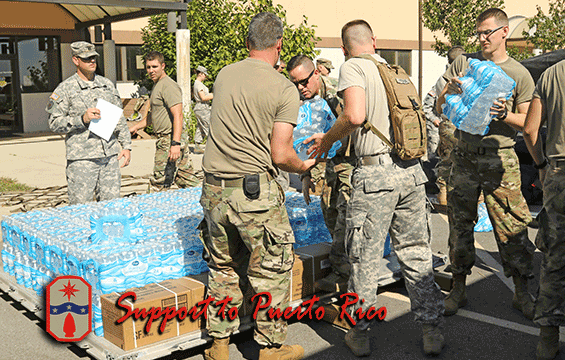 Members of the Ohio National Guard load water onto palettes.