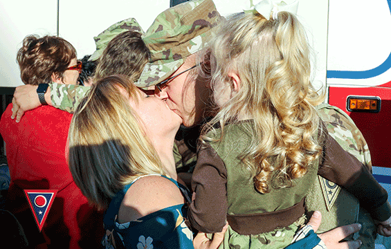 A Soldier with the 323rd Military Police Company reconnects with a loved one.