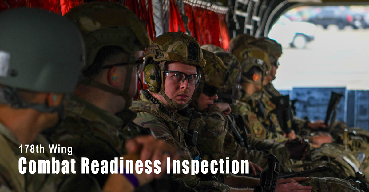 Airmen sit in an Ohio National Guard CH-47 Chinook helicopter