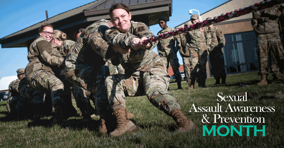 Airmen in tug-o-war contest: Sexual Assault Awareness and Prevention Month