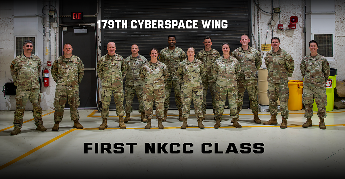 A group of Airmen stand for a photo