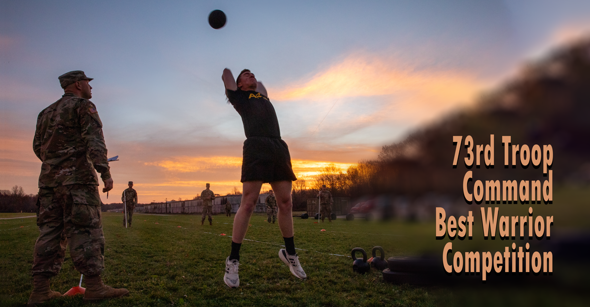 Soldier launches medicine ball at sunset while Solider watches. 