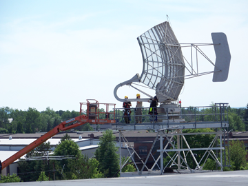 Members of the 212th EIS, based in Milford, Mass., prepare to disconnect the feed horn from the L Band antenna at Rome Research Site. 