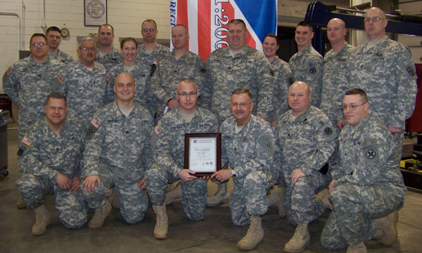 Employees of Field Maintenance Shop 17 at Camp Perry in Port Clinton show off a certificate awarding the facility the ISO 9001:2008 certification. 