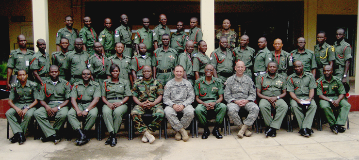 Sgt. 1st Class Ronald T. Hetrick (front row, sixth from left), the Warrior Leader Course branch chief with the Ohio Army National Guard's 147th Regiment (Regional Training Institute) , takes a photo with staff and cadre Aug. 4, 2011, during an Ohio-Nigeria military exchange.