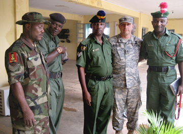 Hetrick (fourth from left) meets with Nigerian soldiers