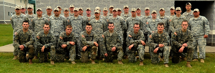 Soldiers who earned the Expert Infantryman Badge at a qualification event held June 9-13, 2013, at Camp Ravenna Joint Military Training Center, pose with the cadre who trained and evaluated them. 