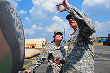 Maj. Gen. Deborah A. Ashenhurst, Ohio adjutant general, views water sample with Guard Member.