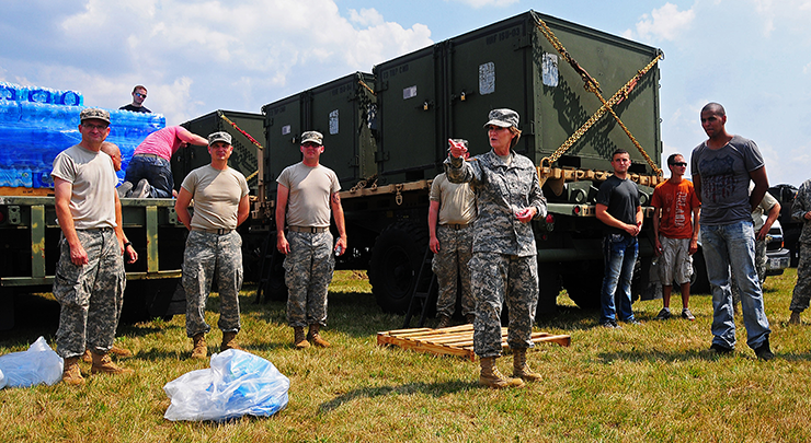 Maj. Gen. Deborah A. Ashenhurst (center) with Guard Members delivering water.