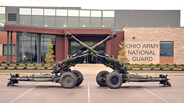 Two M119 howitzers of the 1st Battalion, 134th Field Artillery Regiment are displayed in front of the Delaware Readiness Center.