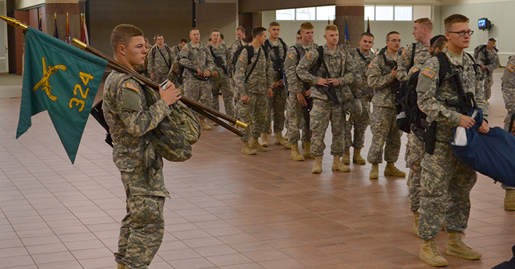 Soldiers assigned to the 324th Military Police Company line up to be weighed.
