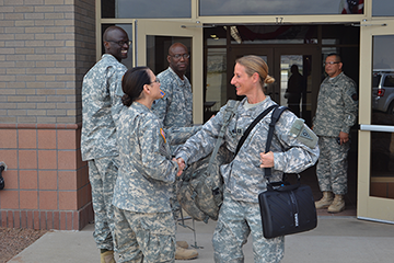 Command Sgt. Maj. Jane Baldwin (left), command sergeant major, 2206th Mobilization Support Battalion, bids farewell to Capt. Kimberly Snow, 324th Military Police Company commander.
