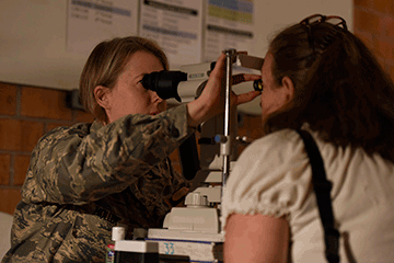 Capt. Jill Holler conducts a vision test.