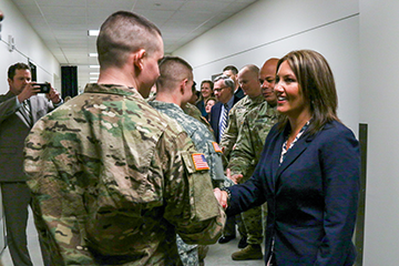 Ohio Lt. Gov. Mary Taylor shakes hands with members of the 1st Battalion, 148th Infantry Regiment.
