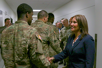 Ohio Lt. Gov. Mary Taylor shakes hands with members of the 1st Battalion, 148th Infantry Regiment.