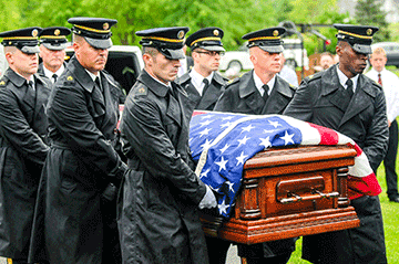 Soldiers from the Ohio Army National Guard Military Funeral Honors Team carry the casket of Technician 4th Grade John Kovach Jr. 