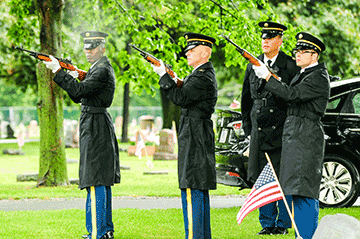 Soldiers from the Ohio Army National Guard Military Funeral Honors Team fire a three round volley during graveside services for Technician 4th Grade John Kovach Jr. 