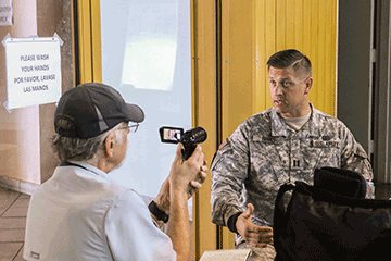 Brian Albrecht (left), a reporter from the Cleveland Plain Dealer in Ohio, interviews Capt. Richard Binks of the 285th Medical Company.