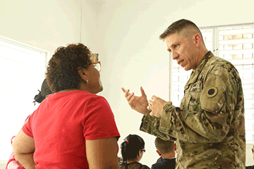 Capt. David Kirker, a behavioral health specialist attached to the 285th Medical Company (Area Support), shares his expertise with a Puerto Rican citizen.