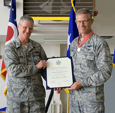 Brig. Gen. Gregory N. Schnulo receives his certificate of retirement from Maj. Gen. Mark E. Bartman, Ohio adjutant general.