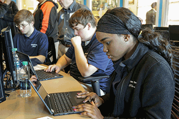 Students at computer.